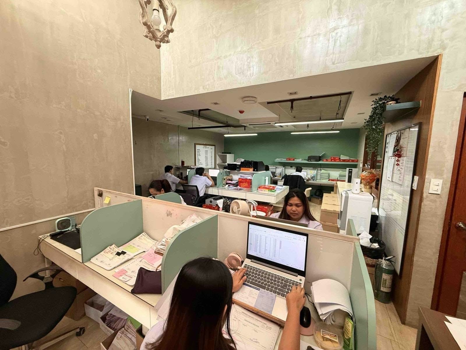 Team members working at adjoining desks